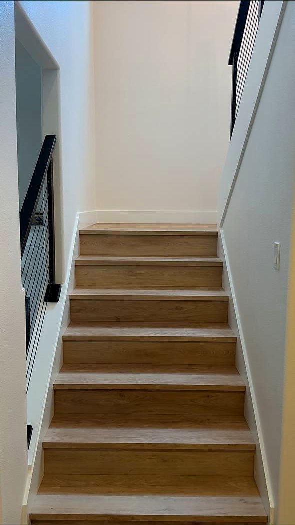 Light oak treads and risers on a straight stair run